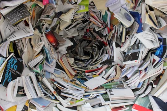 Image: hundreds of books form what appears like a storm funnel