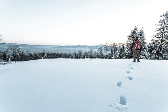 A person forging a path in the snow. Give yourself the love, courage, and permission to walk your chosen path.
