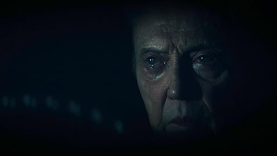 Christopher Walken behind the wheel in the shadows on Severance