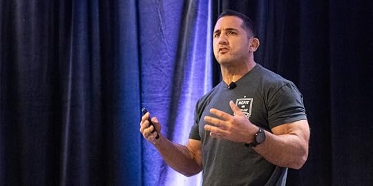 Jason Khalipa speaking on stage at the 2023 Two-Brain Summit.