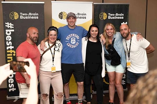 A group of happy gym owners pose at the Two-Brain Summit.
