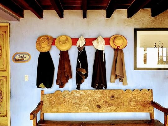 hats and coats hanging on the wall
