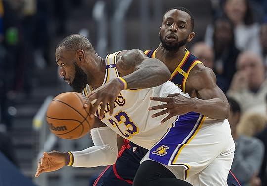 Golden State Warriors’ Andrew Wiggins defends Los Angeles Lakers’ LeBron...