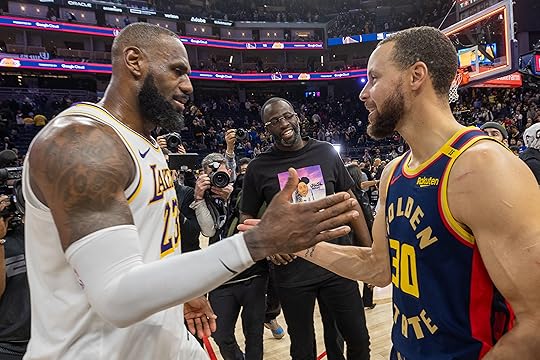 Golden State Warriors’ Stephen Curry and Los Angeles Lakers’ LeBron...