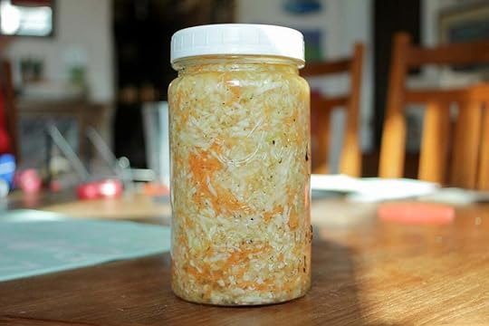 Quart jar of health salad capped with a white lid.