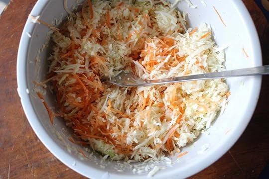 Shredded carrots and cabbage in a bowl for health salad.