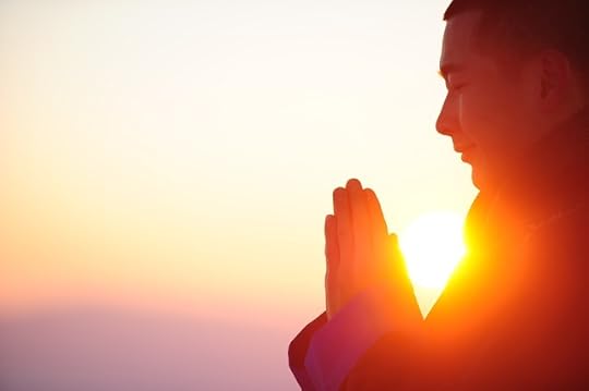 Figure with hands in prayer position, with sun shining between body and hands.