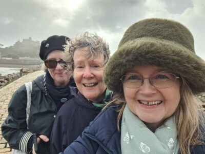photo of Debbie Young, Alison Morton and Lorna Fergusson on the causeway to St Michael's Mount