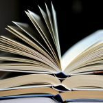 stacked open books
