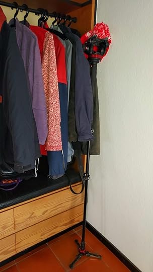 Tripod leaning against the coat rack