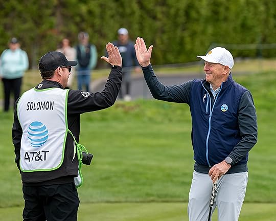 David Solomon, CEO of Goldman Sachs, celebrates with his caddie...