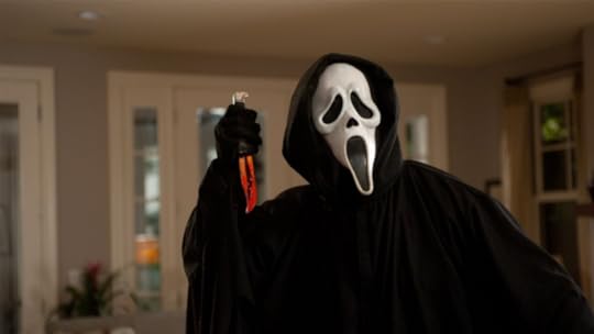 Ghostface holds a bloody knife in a scene from Scream 2.
