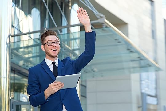 Young man waving from a distance