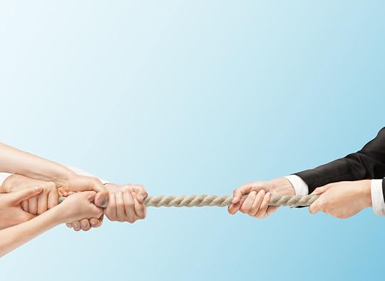 Business people in a tug of war