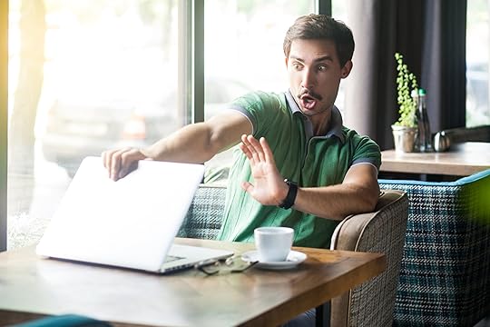 Person closing laptop in horror