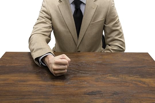 Person pounding fist on desk