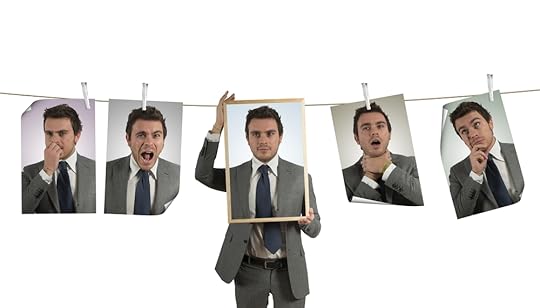 person looking at pictures of himself making different facial expressions