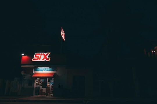 red and white UNKs building during nighttime