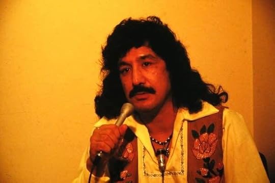 A man holds a microphone