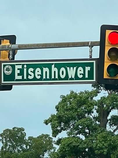 Weathered street sign for Eisenhower street.