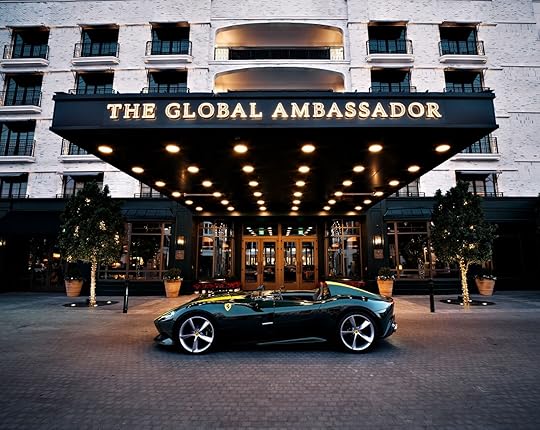 luxury car in front of the global ambassador hotel