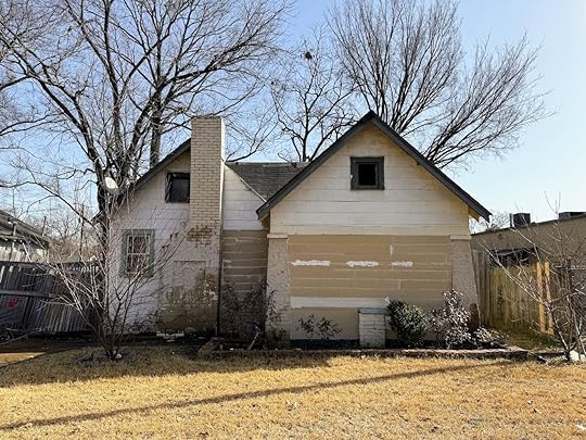 a house with a fence and a yard