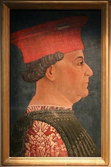 Francsco Sforza wearing a very very very expensive outfit, with pomegranate pattern gold on red brocade silk under an overlayer of a different brocaded silk in gold and green. His hat is also a different style, a cylindrical turret hat.