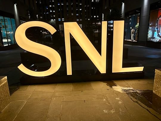 Sign that says SNL in gold letters.jpg