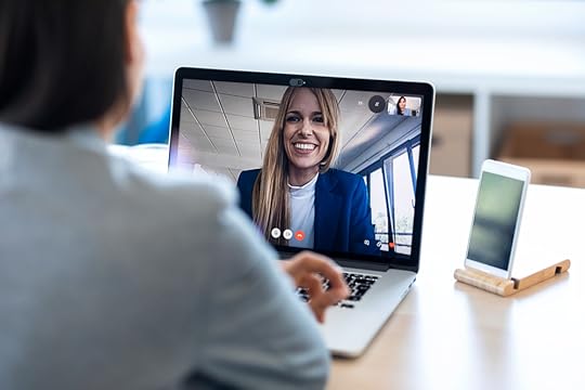 Two colleagues talking over a video call