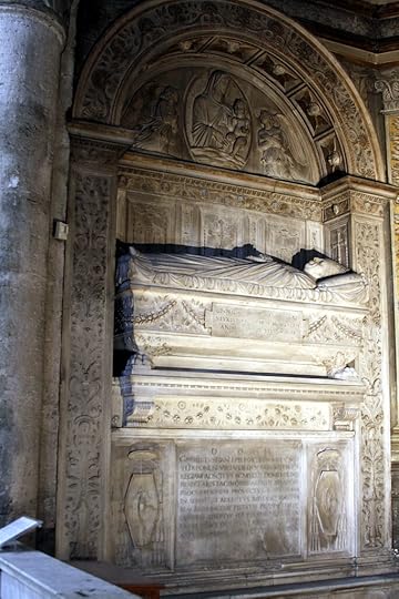 Extremely similar-looking tomb, obviously in the same style and period, in which Cardinal da Costa appears full body life-sized sleeping on a fancy sarcophagus beneath a marble arch with saints, just like the other. His crest of a wheel (invented for himself) appears in several places.