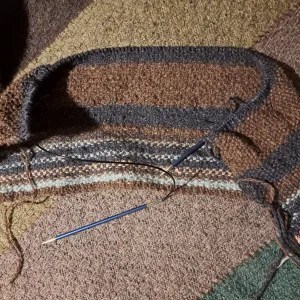 photo of the temperature blanket so far, against the background of the Scottish Highland blanket