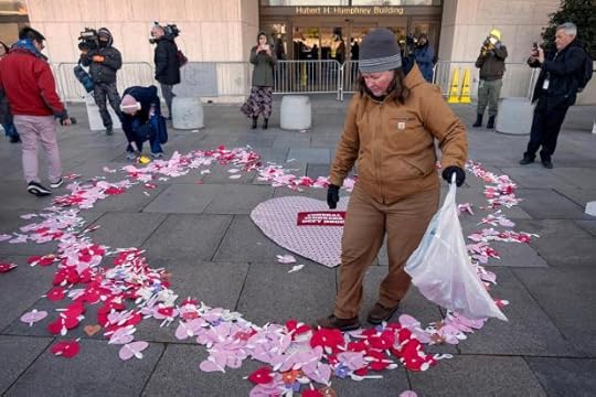 Demonstrators rallying in support of federal workers spread Valentine's Day themed messages for them