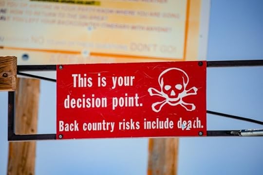 A sign that reads “This is your decision point. Back country risks include death.” You choices and decisions are everything.