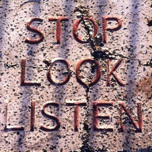 Street sign that reads stop, look, listen