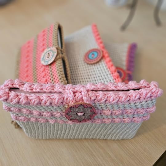 Crocheted book sleeves in pink.