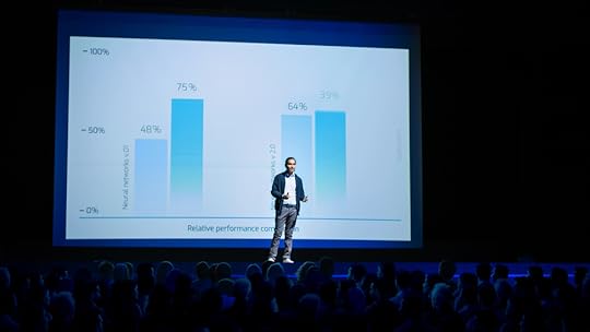 A man presenting on stage