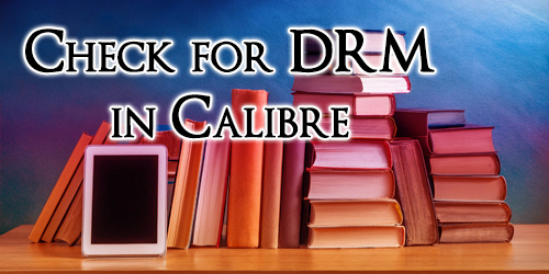 Piles of books on a desk with a Kindle in front of them