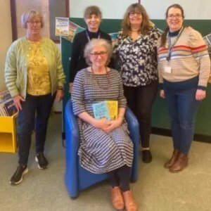 photo of Debbie with both Cotswold Curiosity Shop books and the librarians at Thornbury Library