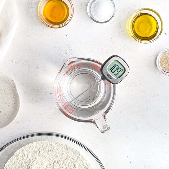 A instant-read thermometer taking the temp for water before making focaccia bread.