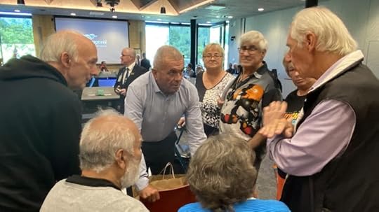WDC councillor Gavin Benney, centre rear in blue shirt, talks with anti fluoride campaigners at the council's December meeting.