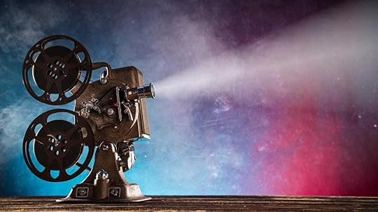 A movie projector with a colorful backgroundAI-generated content may be incorrect.