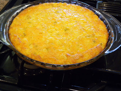 picture of a cornbread casserole in a glass pie pan