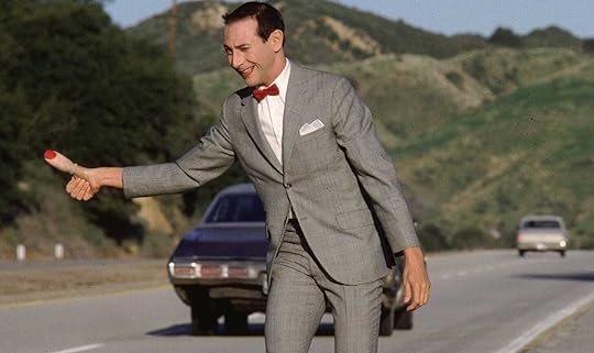 Paul Reubens thumbing it in character in