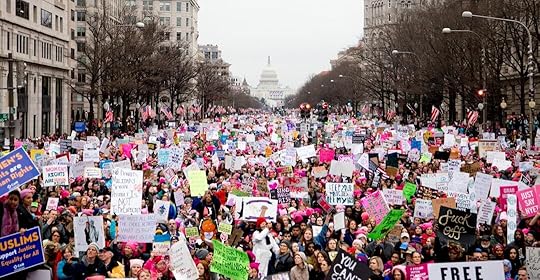 crowd of people holding placards