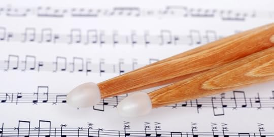 drum sticks on sheet music