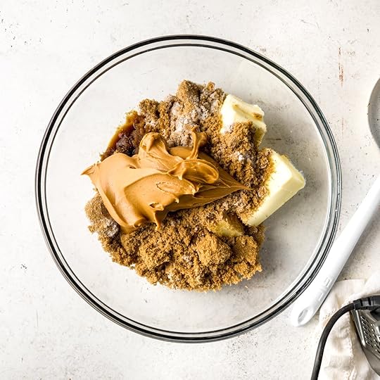 Peanut butter, brown sugar, sugar and butter in a bowl ready to be mixed.