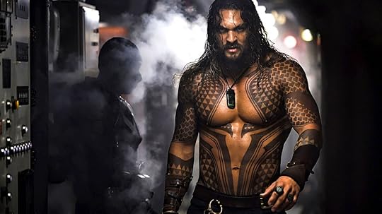 Shirtless Jason Momoa walking through steam on a submarine in Aquaman