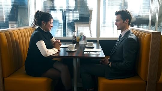 Amber Midthunder and Jack Quaid in profile at a diner table in Novocaine