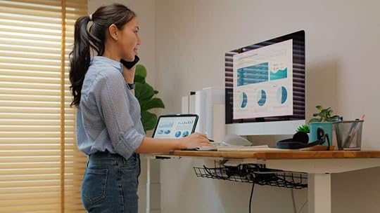 employee at standing desk evaluating benefits that support the employee lifecycle