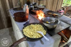 pans with food on a woodstove